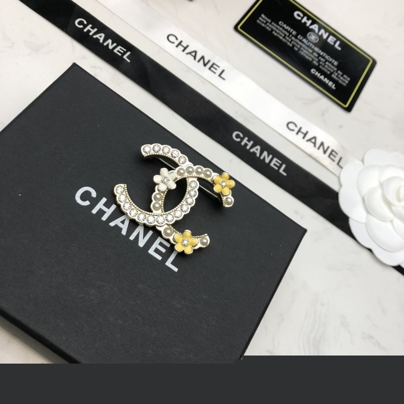 Ch*el brooches